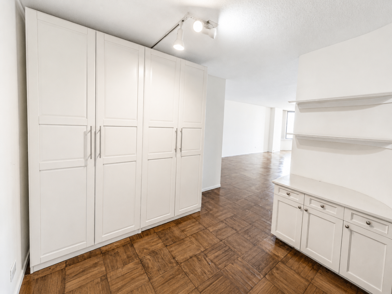 Built-in storage and open living view inside Residence 21J